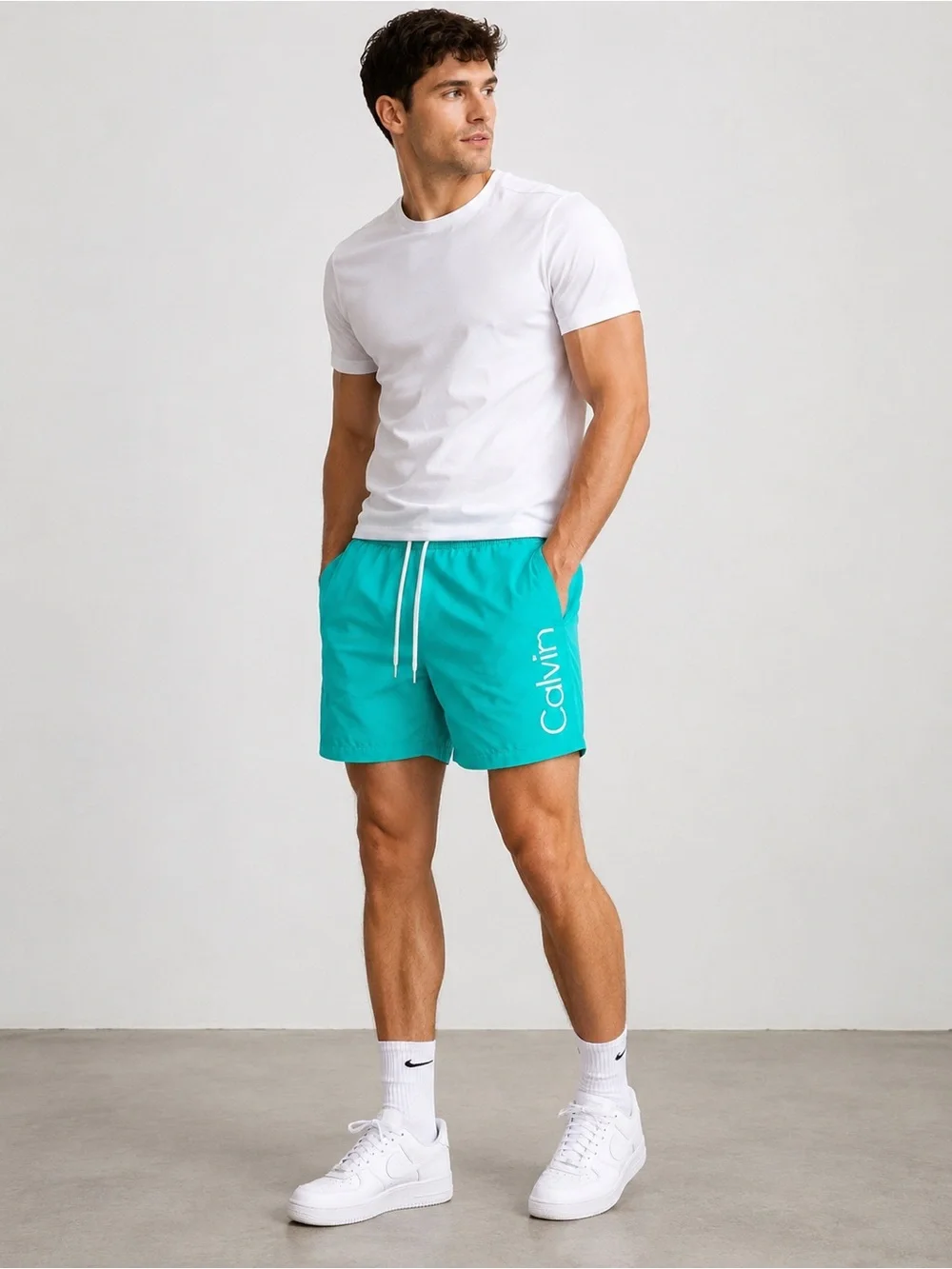 Calvin Klein Bright Teal Swim Shorts with White Logo